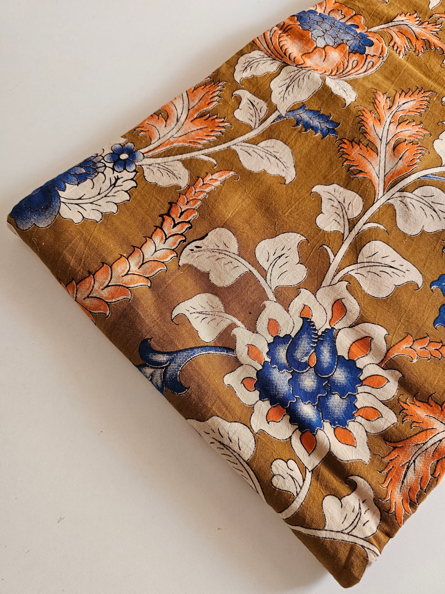 Kalam Kari Fabric Musted with blue, orange Flower design.